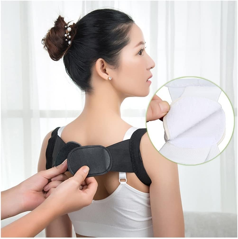 Person adjusting a black shoulder brace on another person with a white background